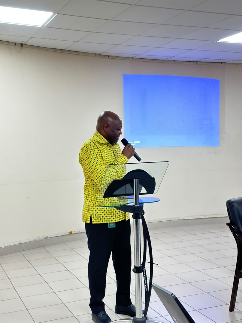 A dignitary addresses participants at the meeting